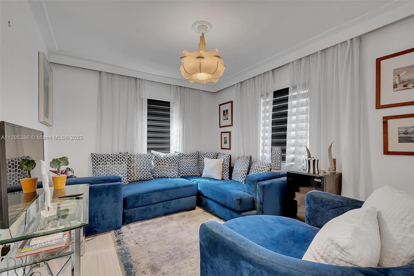 1242 Southwest 13th Avenue Miami, FL 33135 - Photo 25 of 42 a living room with furniture and a large window