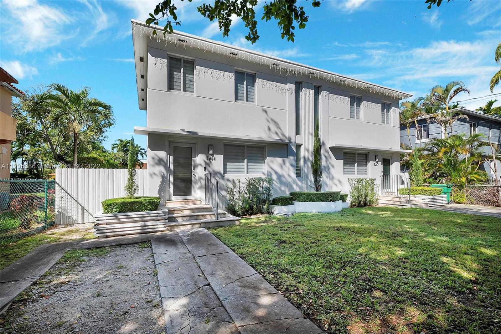 1242 Southwest 13th Avenue Miami, FL 33135 - Photo 3 of 42 a front view of a house with a yard