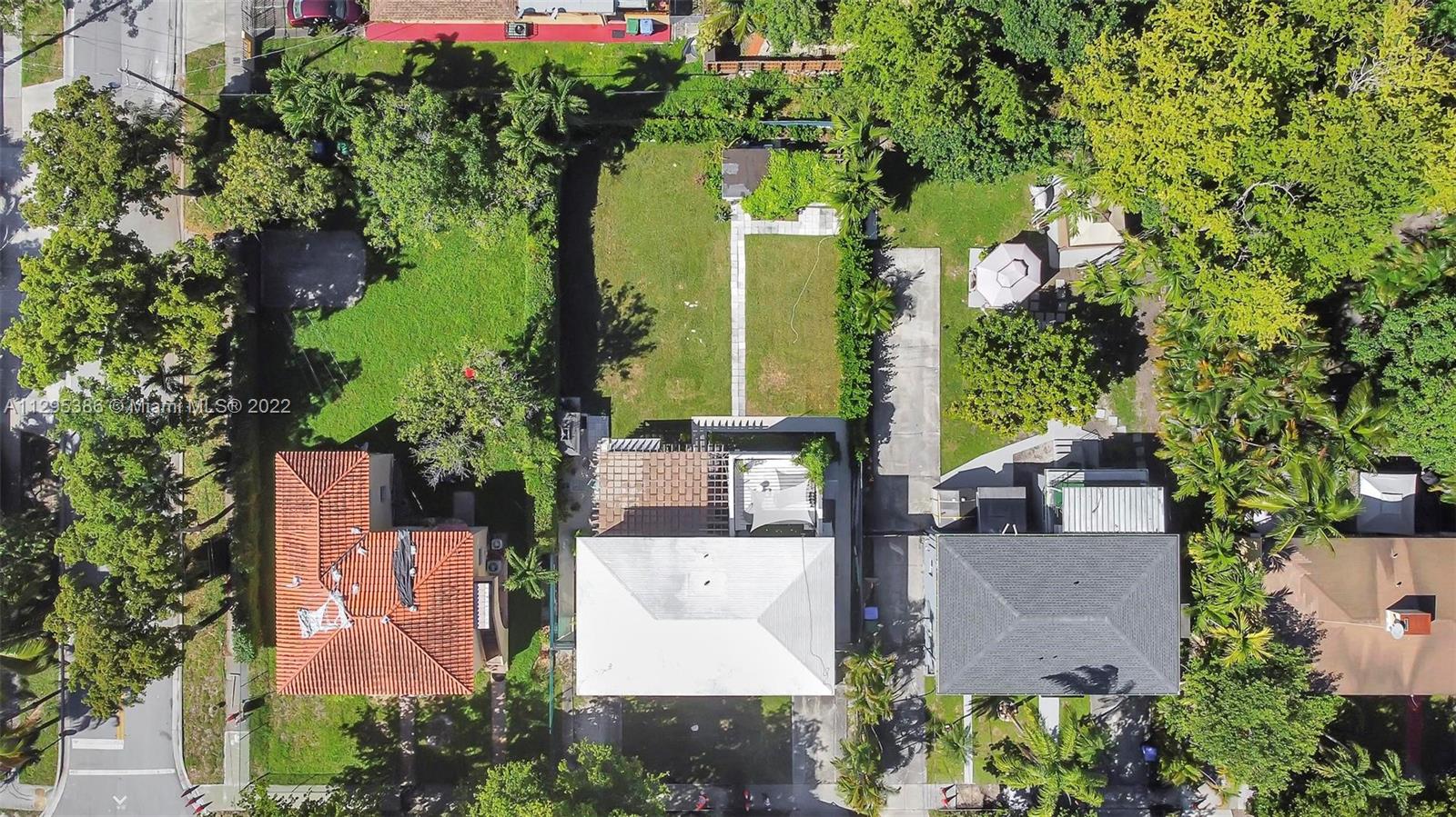 1242 Southwest 13th Avenue Miami, FL 33135 - Photo 35 of 42 an aerial view of a house with yard and outdoor seating