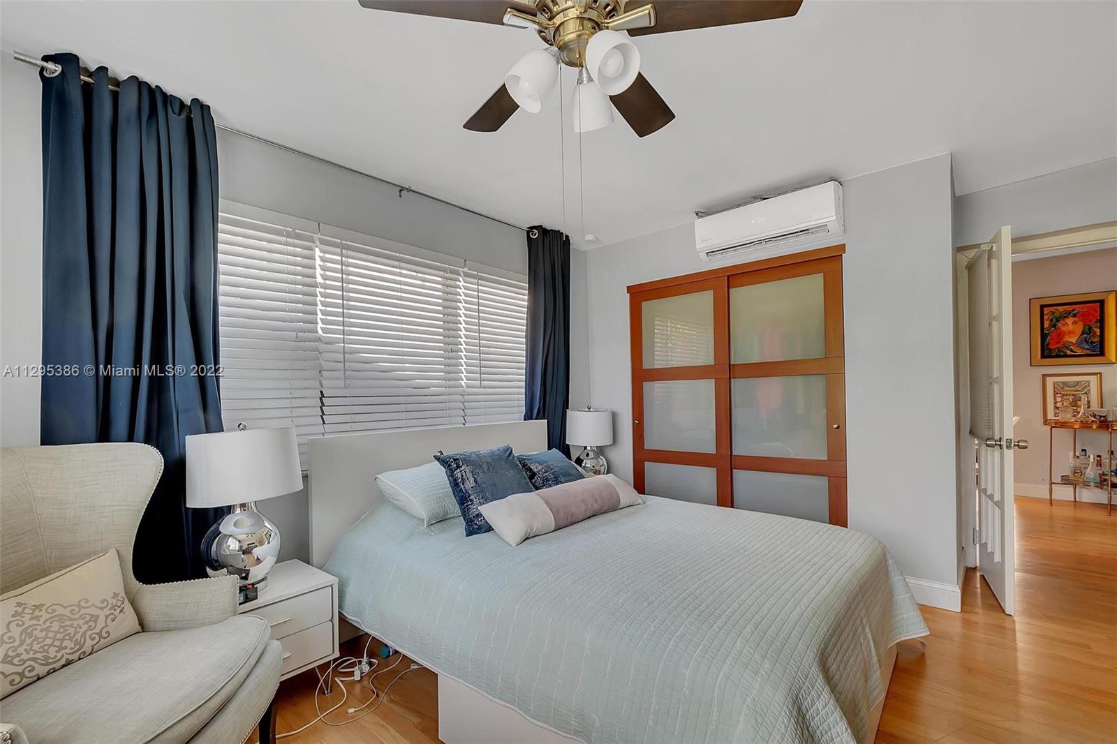 1242 Southwest 13th Avenue Miami, FL 33135 - Photo 10 of 42 a bedroom with furniture and a large window