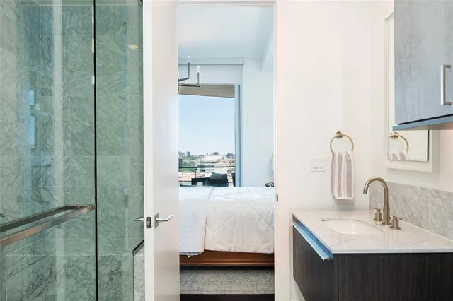 a en suite bathroom with a sink and mirror