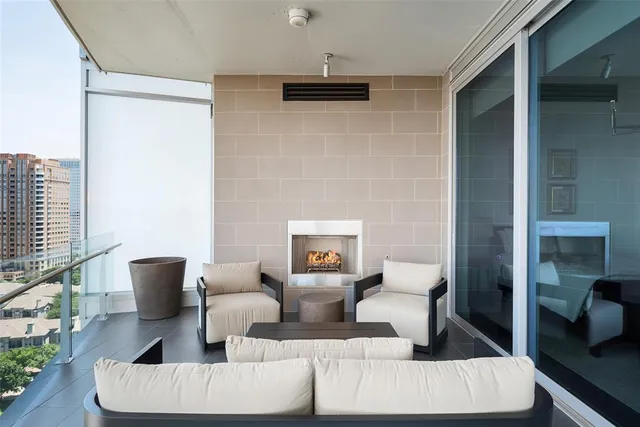 a living room with couches and a fireplace