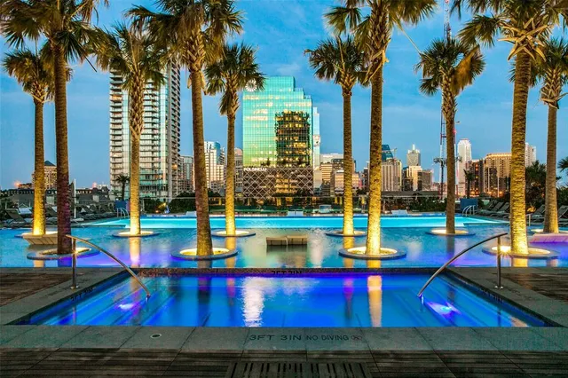 a view of swimming pool with a patio and a yard