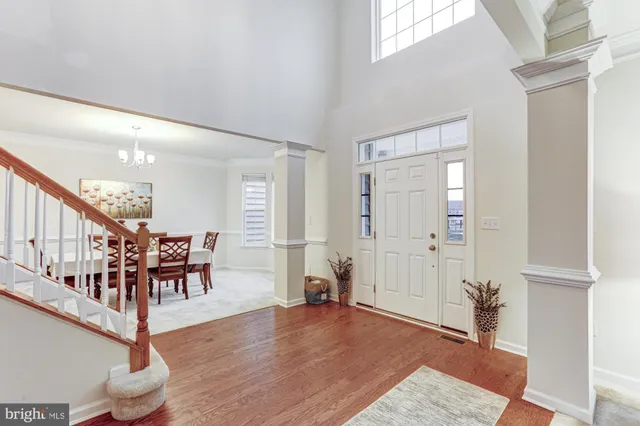 a living room with furniture and a ceiling fan