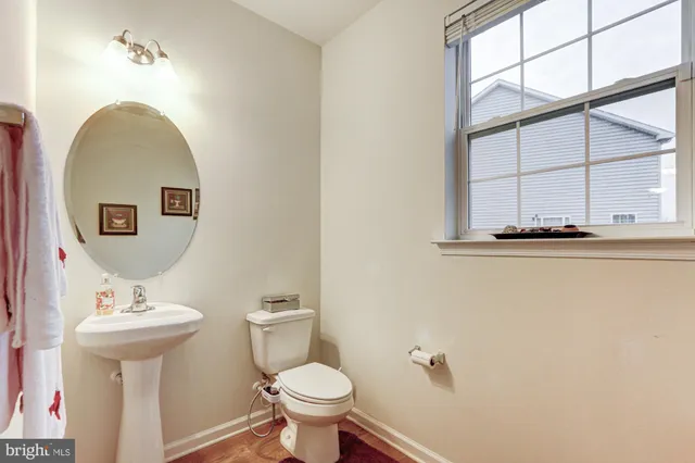 a spacious bedroom with a bed and a chandelier
