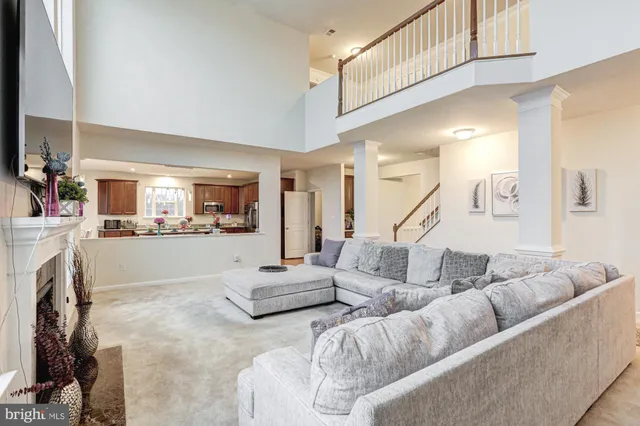 a spacious bedroom with a bed and a chandelier