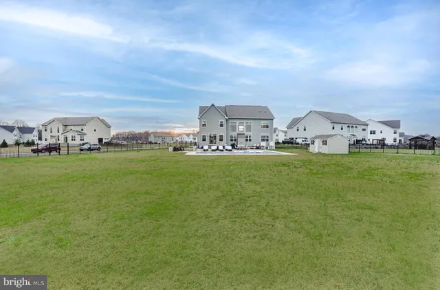 a view of a dining room with furniture and window