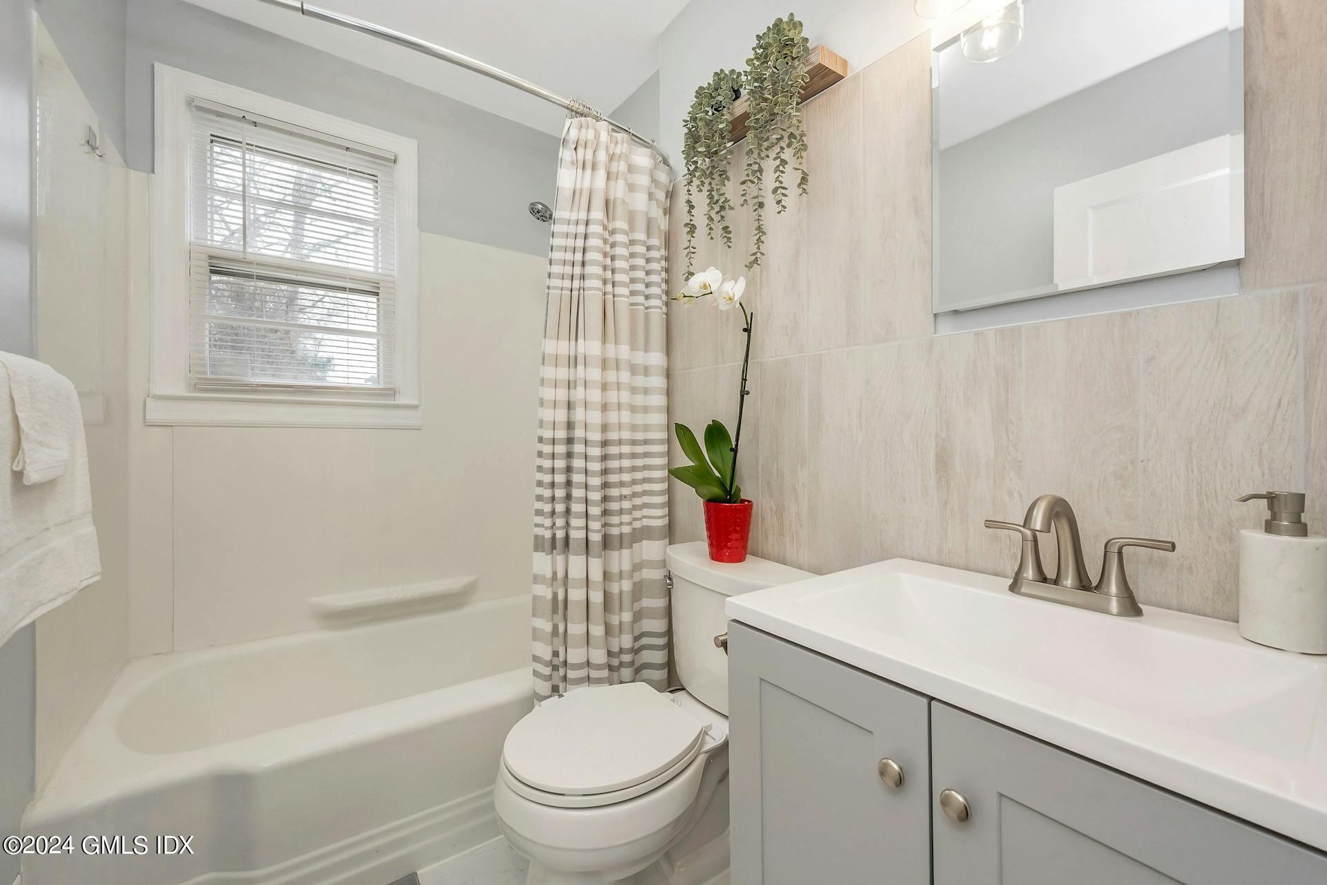 37 Leighton Road Trumbull, CT 06606 - Photo 11 of 24 a bathroom with a sink toilet and shower