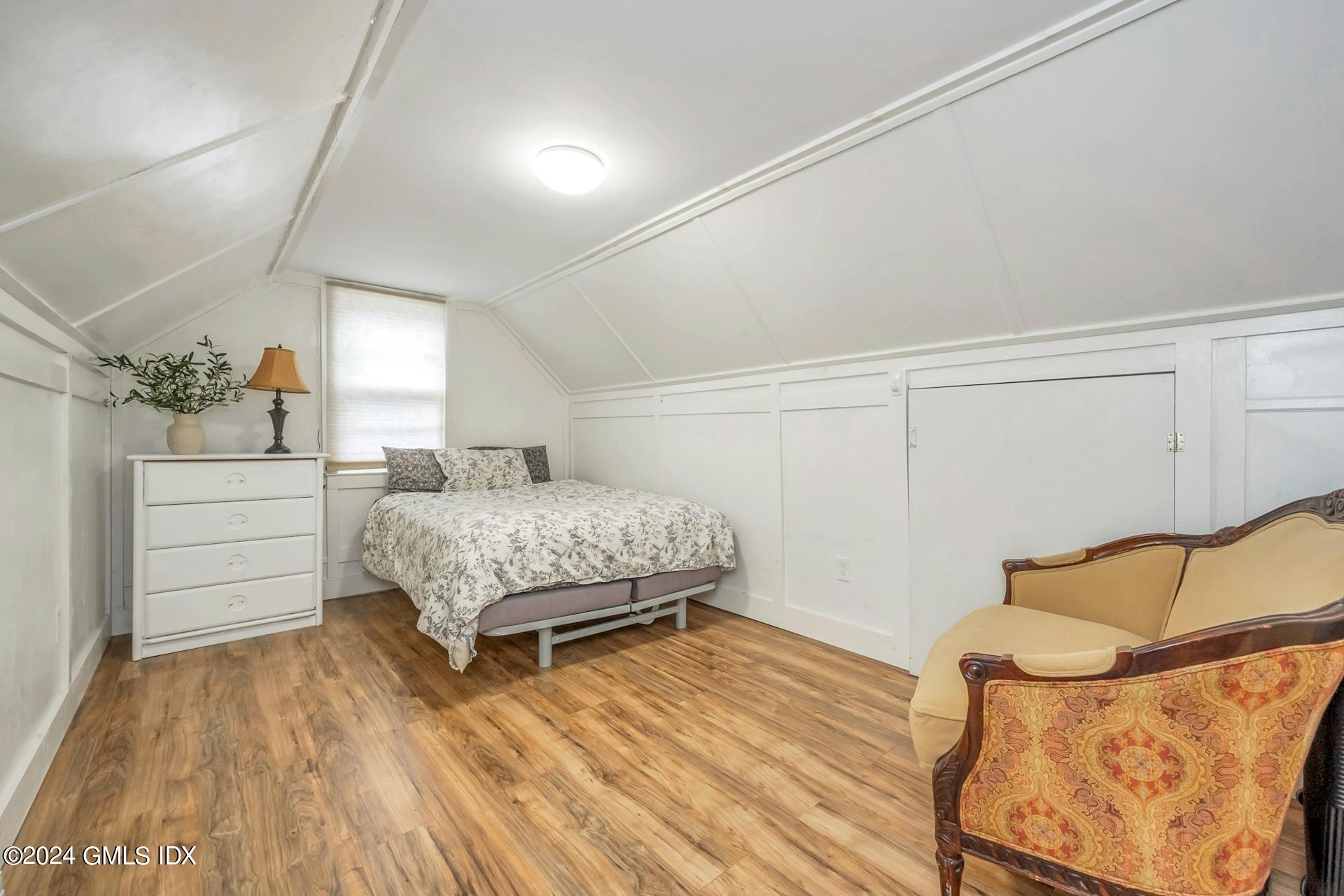 37 Leighton Road Trumbull, CT 06606 - Photo 12 of 24 a bedroom with a bed and closet with wooden floor