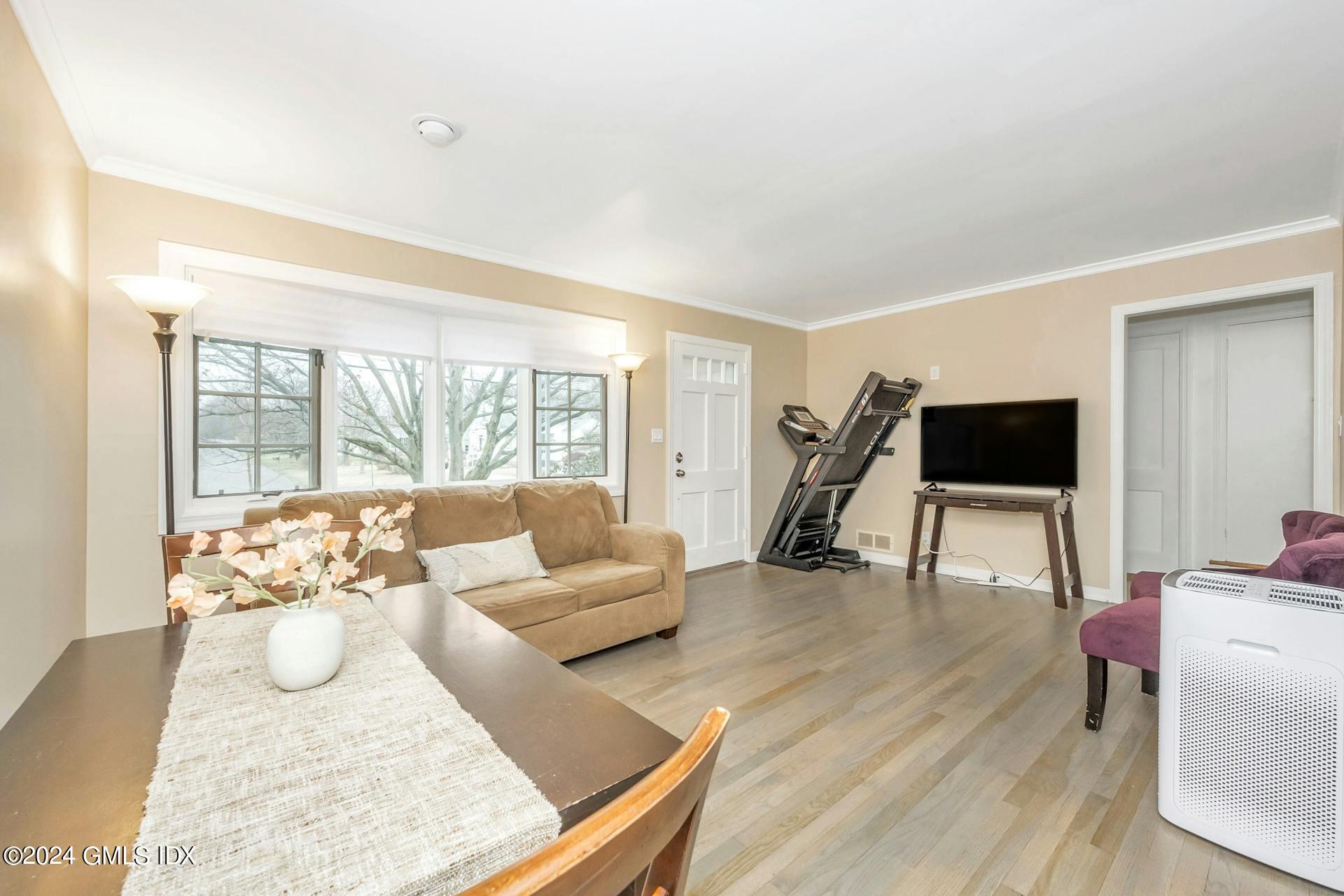 37 Leighton Road Trumbull, CT 06606 - Photo 5 of 24 a living room with furniture and a flat screen tv