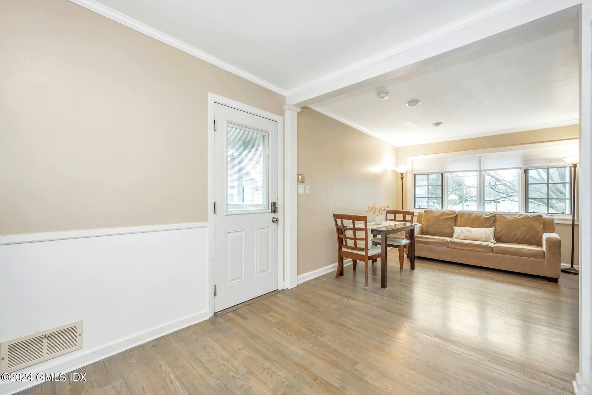37 Leighton Road Trumbull, CT 06606 - Photo 6 of 24 a view of a livingroom with furniture and wooden floor