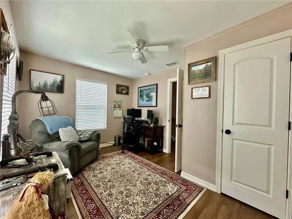 a living room with furniture and a rug
