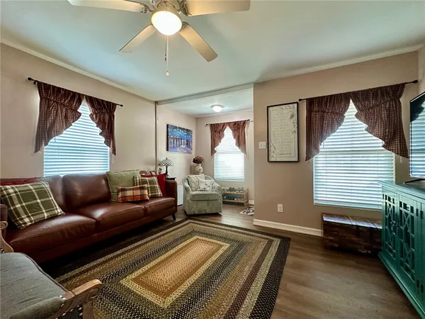 a living room with furniture and a rug