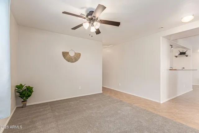 an empty room with potted plants
