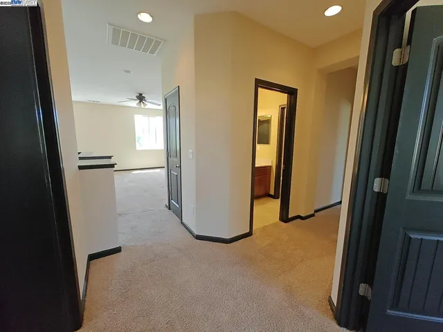 a view of a hallway with closet area