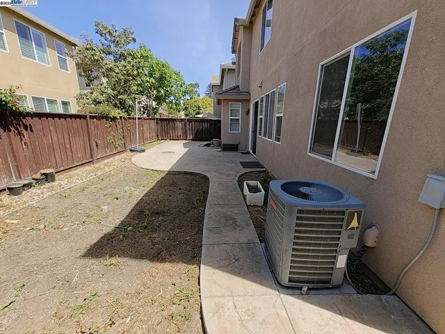 a view of backyard with a patio