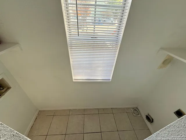 a view of a room that has a window in it