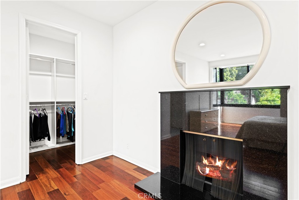 1277 South Beverly Glen Boulevard, Unit 405 Los Angeles, CA 90024 - Photo 12 of 34 Main Bedroom Fireplace and Walk-in Closet