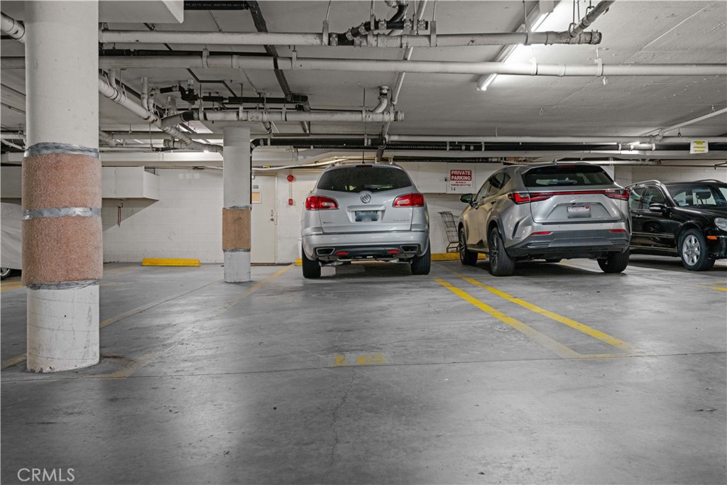 1277 South Beverly Glen Boulevard, Unit 405 Los Angeles, CA 90024 - Photo 26 of 34 Garage spaces by door.