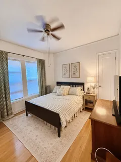 a bedroom with a bed and a dresser