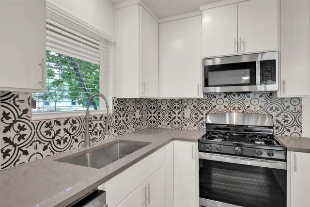 a kitchen with a stove and a sink