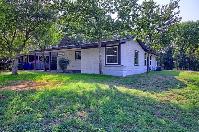a backyard of a house with lots of green space