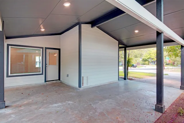 a view of an empty room with a sliding door
