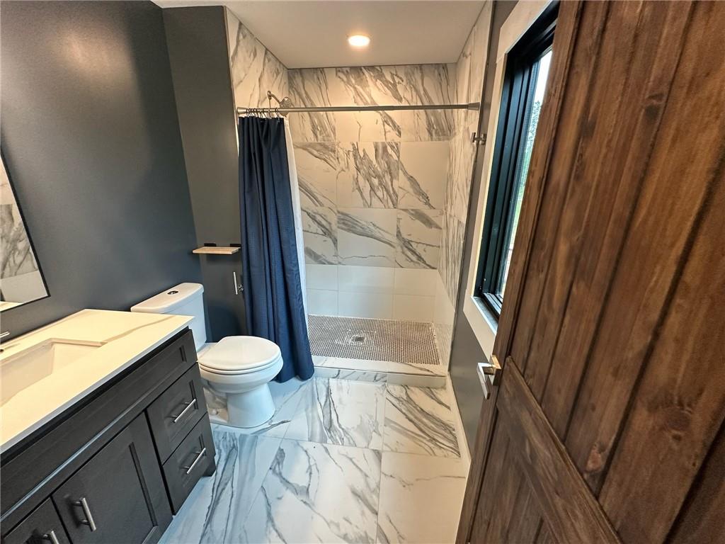 1001 Bailey Road Rome, GA 30161 - Photo 33 of 44 a bathroom with a toilet and a shower