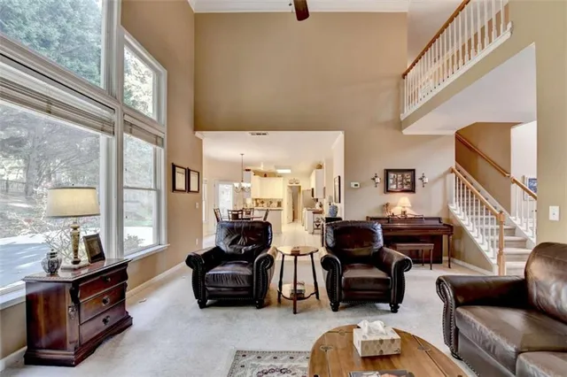 a kitchen with stainless steel appliances granite countertop a sink a stove and cabinets