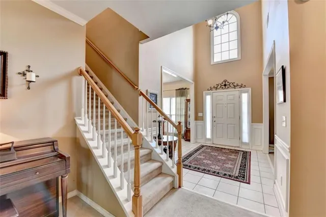 a bedroom with a bed and a television