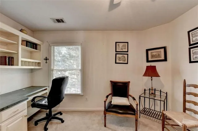 a view of a patio with table and chairs with wooden floor and fence