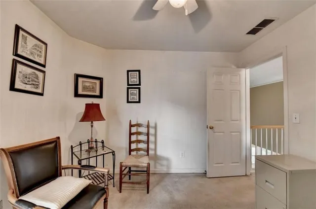 a view of a backyard with large trees