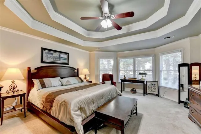 a view of a house with a yard and sitting area