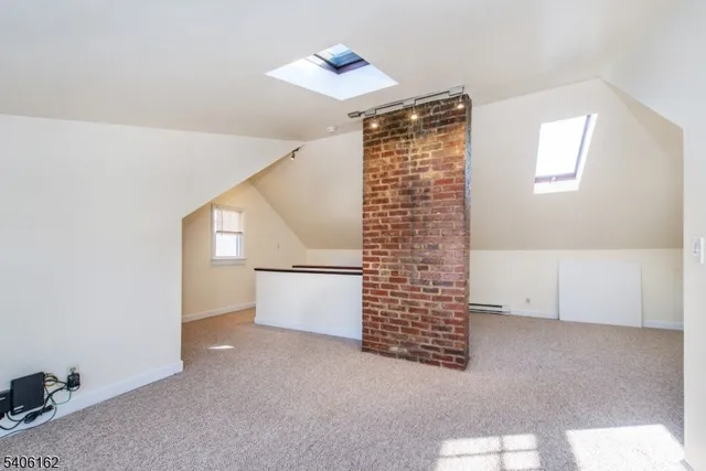 a view of an empty room with windows