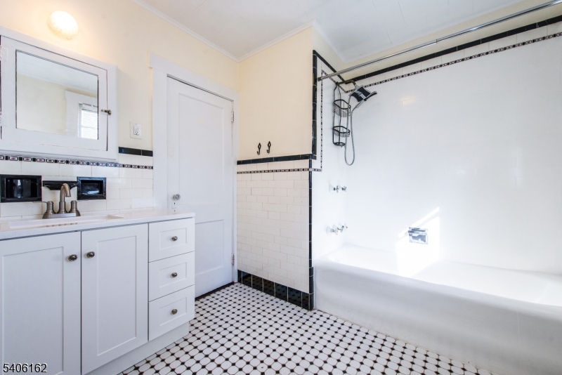 39 Baldwin Place, Unit 2 Bloomfield, NJ 07003 - Photo 10 of 17 a bathroom with a bathtub and a shower
