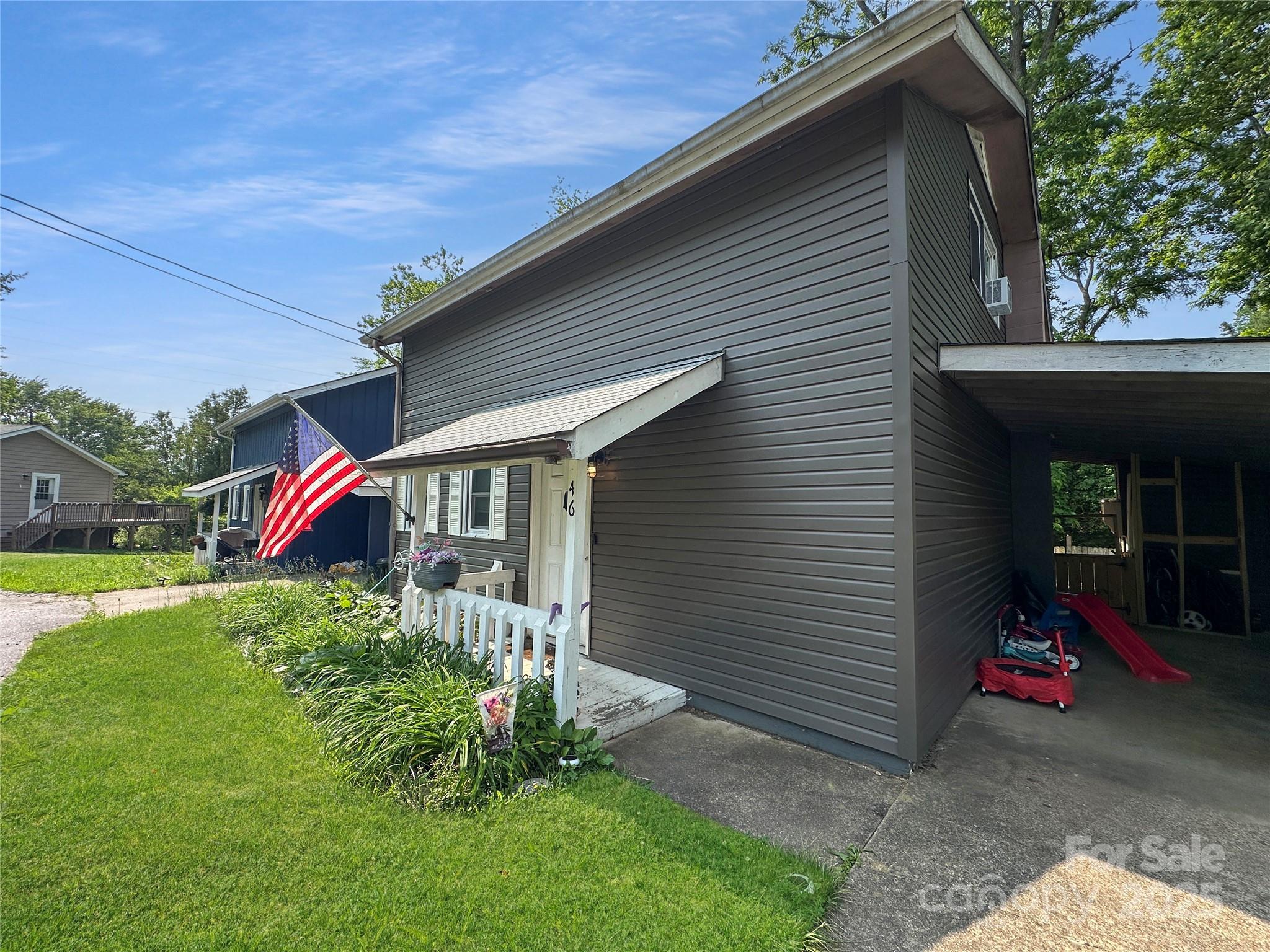 46 Westbrook Circle Clyde, NC 28721 - Photo 3 of 13 a front view of a house with garden