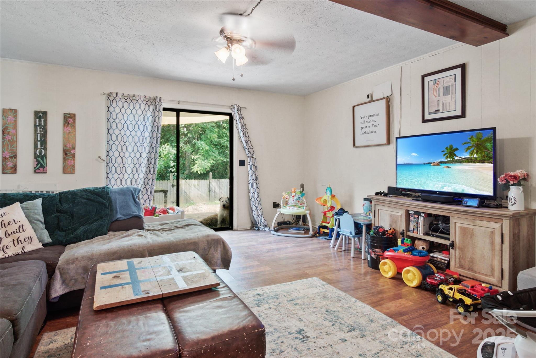 46 Westbrook Circle Clyde, NC 28721 - Photo 4 of 13 a living room with furniture and a flat screen tv