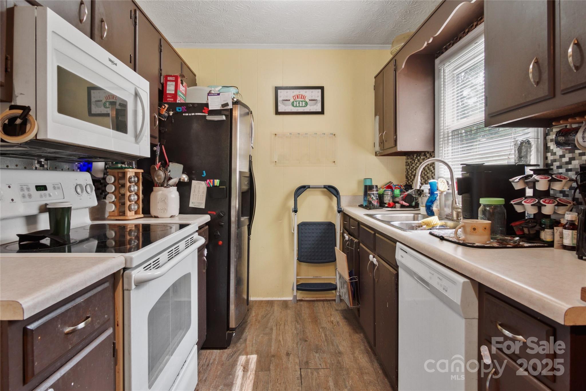 46 Westbrook Circle Clyde, NC 28721 - Photo 6 of 13 a kitchen with stainless steel appliances granite countertop a sink stove and refrigerator