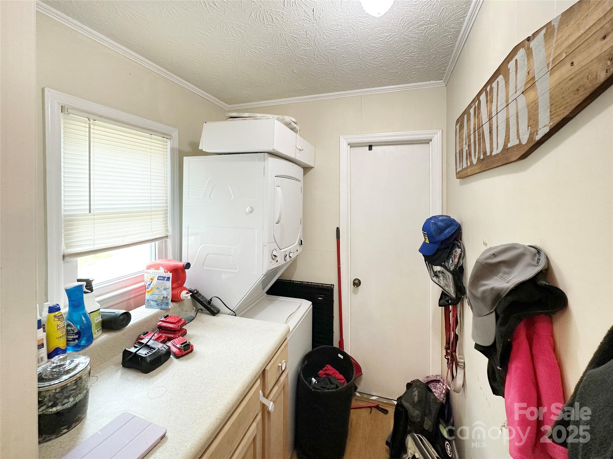 46 Westbrook Circle Clyde, NC 28721 - Photo 7 of 13 a bedroom with a bed and a chandelier