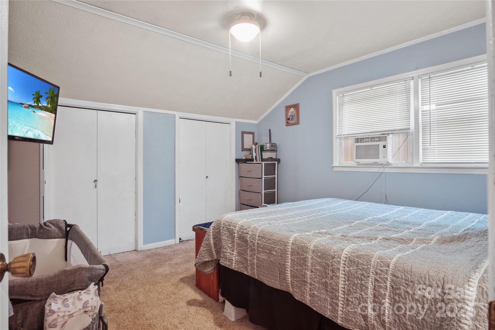 46 Westbrook Circle Clyde, NC 28721 - Photo 8 of 13 a bedroom with a bed and a window