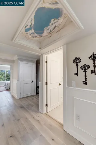 a view of a livingroom with wooden floor and cabinet