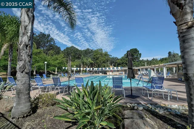 a view of a garden with sitting area