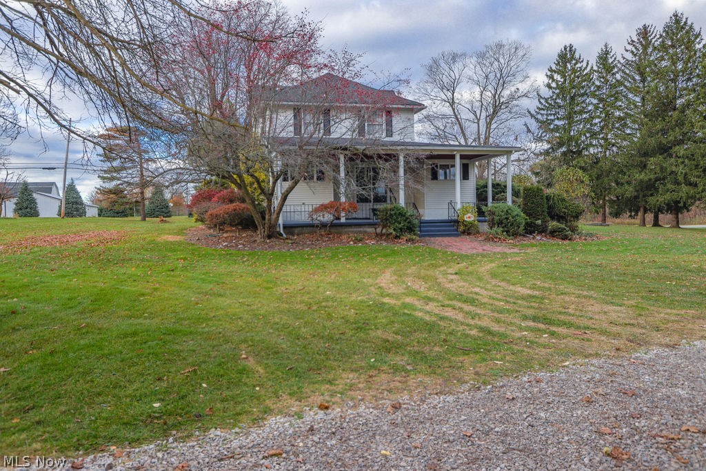 51883 Telegraph Road Amherst, OH 44001 - Photo 35 of 49 View of front of property featuring covered porch and a front lawn