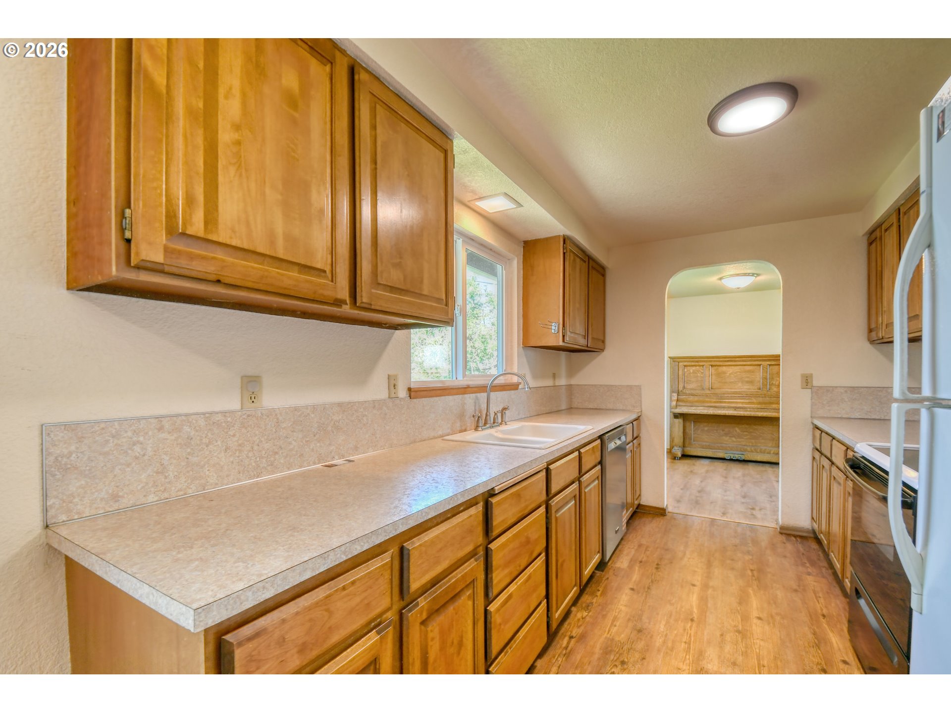 1107 Southwest 23rd Street Pendleton, OR 97801 - Photo 19 of 42 a kitchen that has a sink and a stove