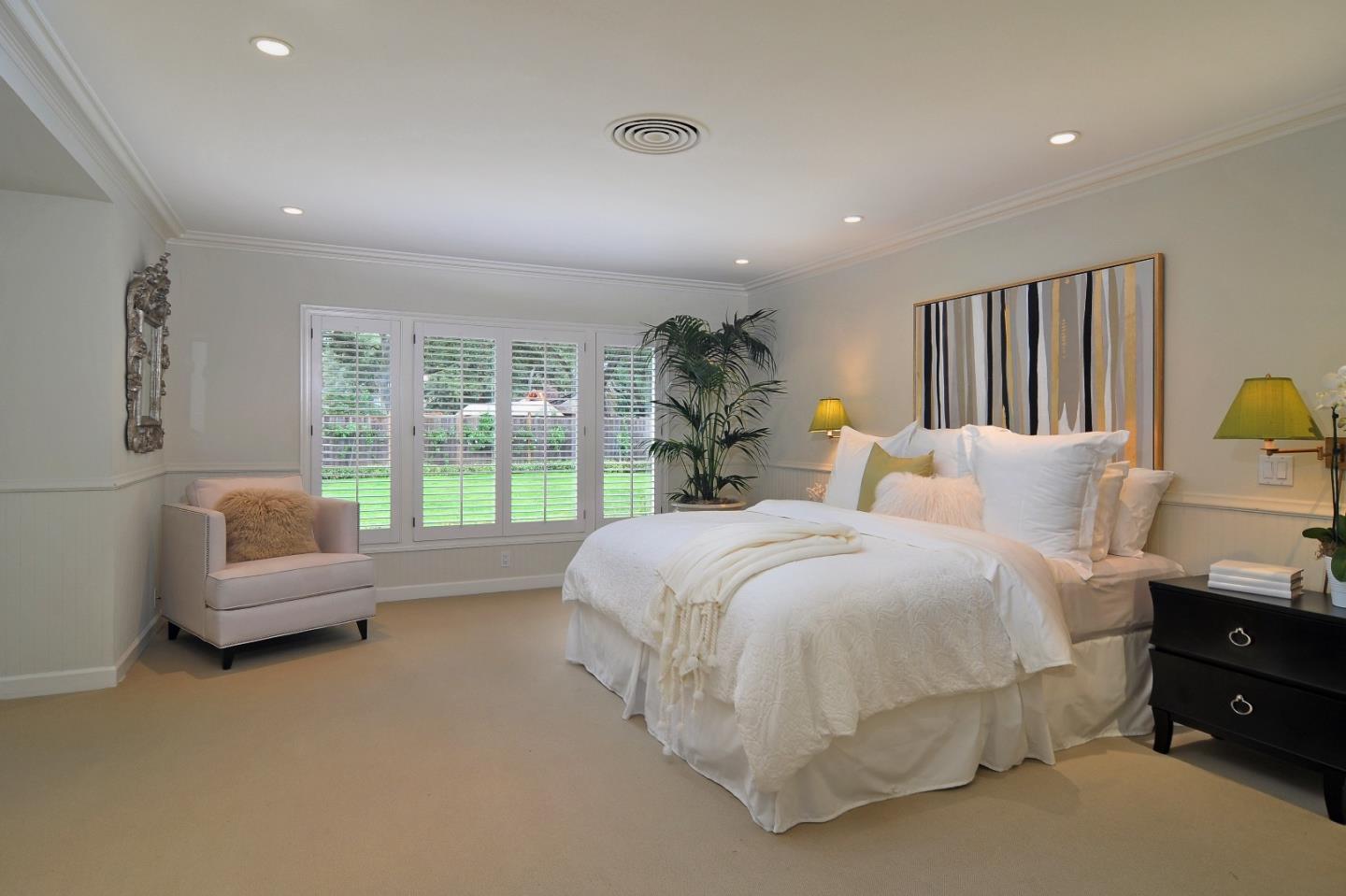 47 Ralston Road Atherton, CA 94027 - Photo 13 of 35 a spacious bedroom with a bed and a couch