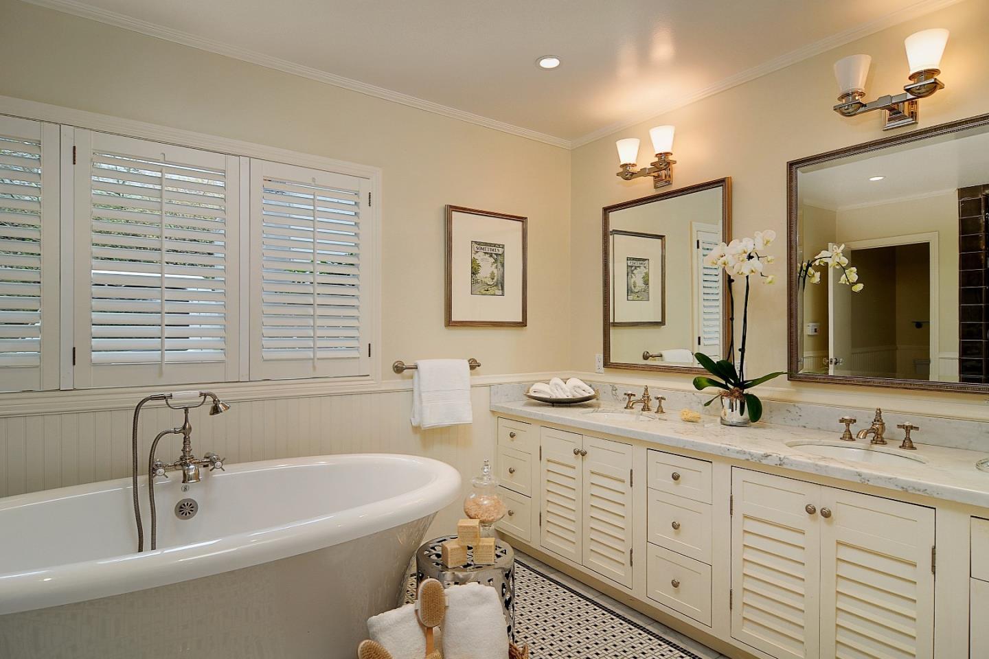 47 Ralston Road Atherton, CA 94027 - Photo 14 of 35 a bathroom with a granite countertop tub sink double vanity and a mirror