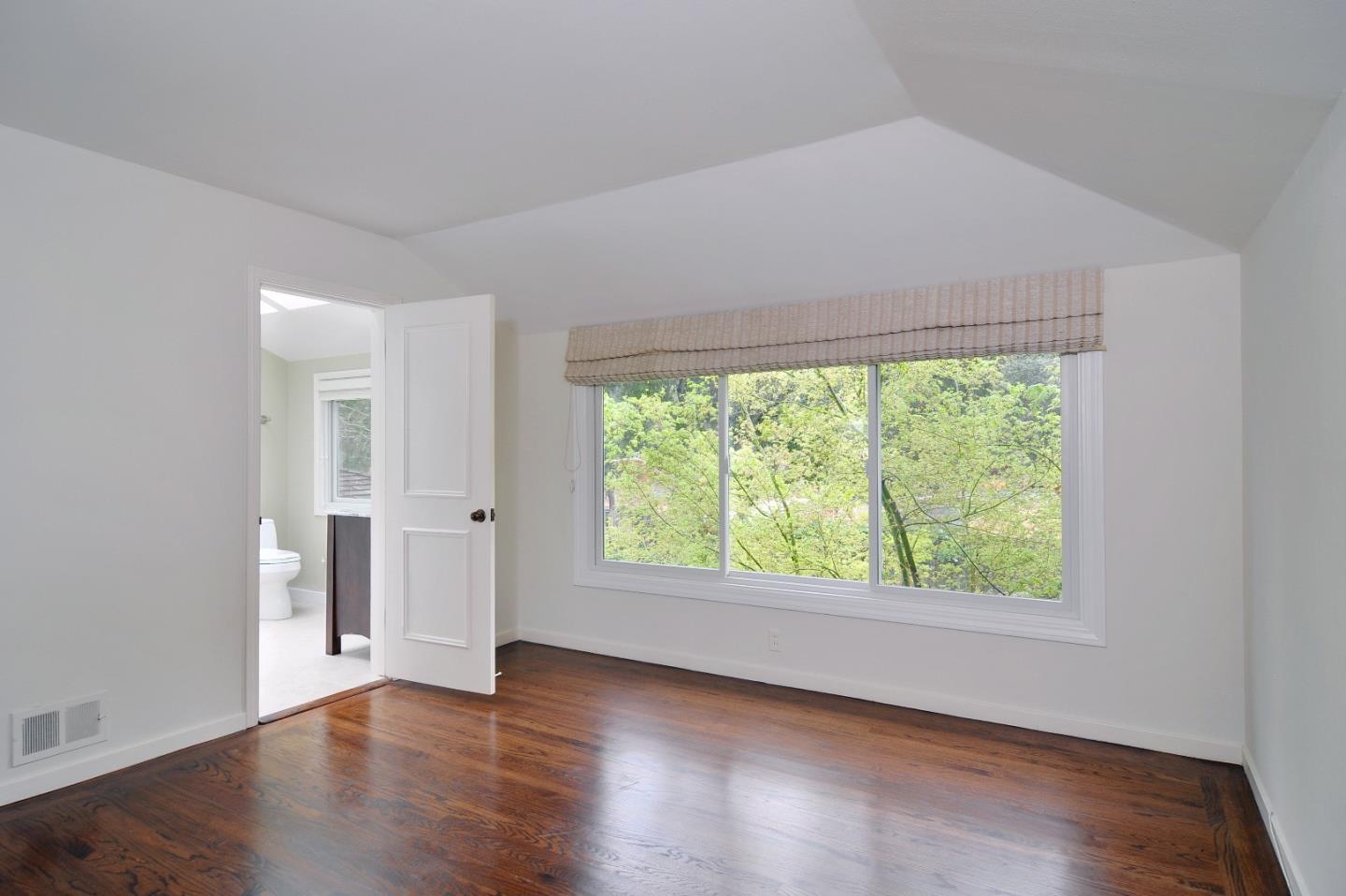 47 Ralston Road Atherton, CA 94027 - Photo 18 of 35 an empty room with wooden floor and windows