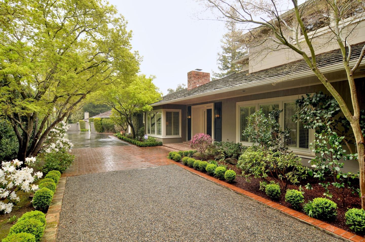 47 Ralston Road Atherton, CA 94027 - Photo 35 of 35 front view of a house with a yard and potted plants