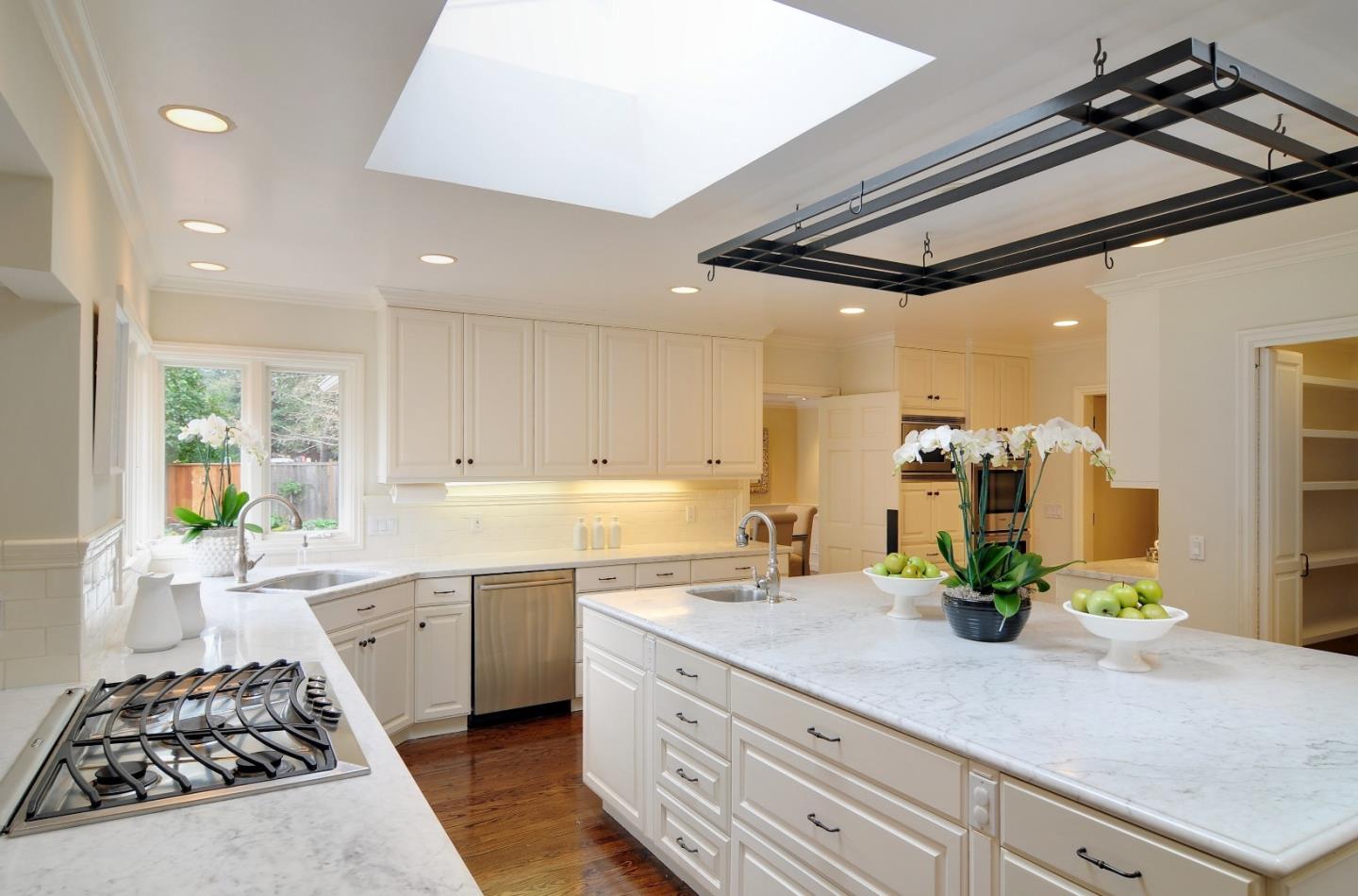 47 Ralston Road Atherton, CA 94027 - Photo 9 of 35 a kitchen with a sink stainless steel appliances and cabinets