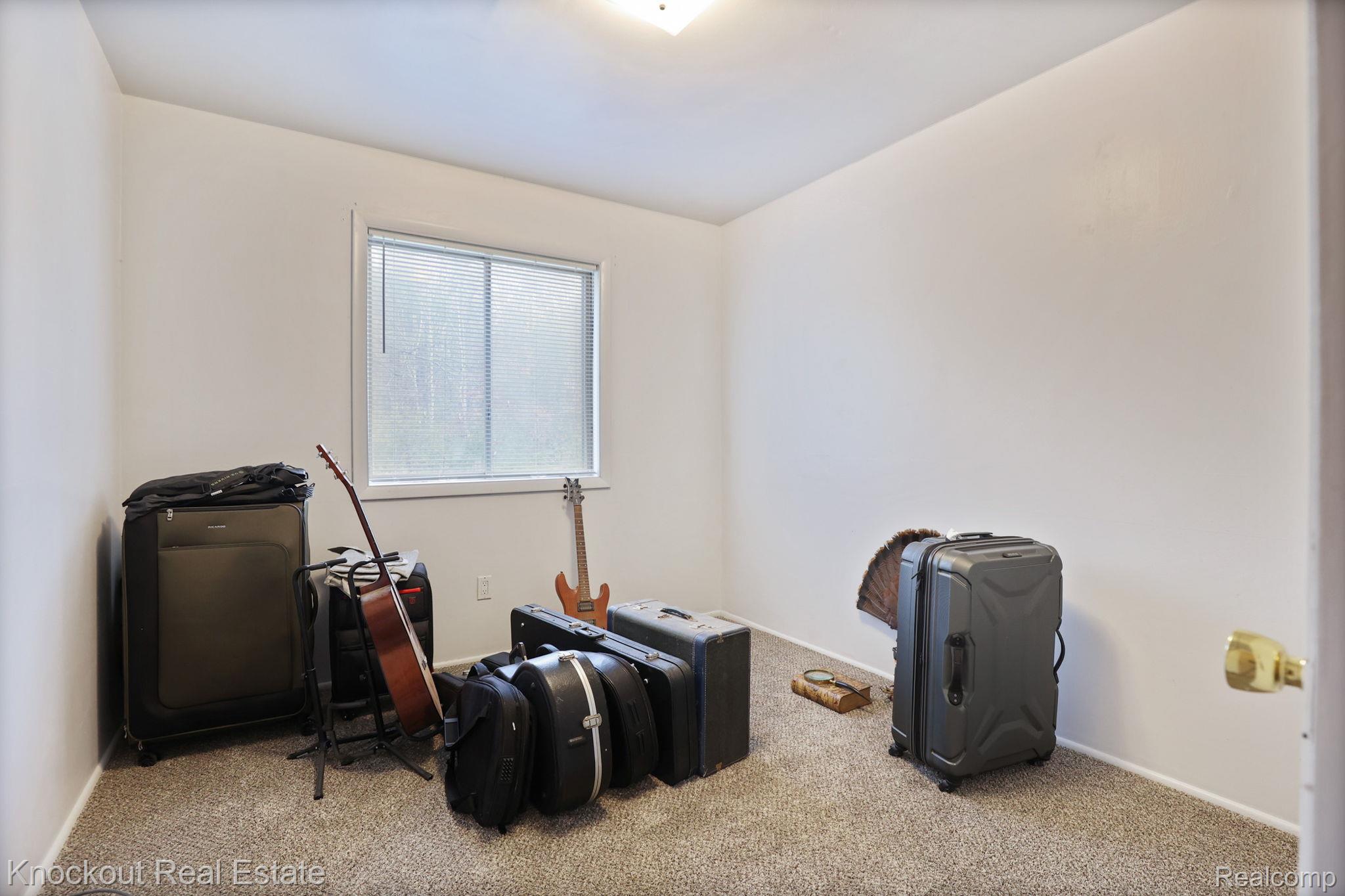 10456 North Nichols Road Montrose, MI 48457 - Photo 24 of 39 Miscellaneous room with carpet and baseboards